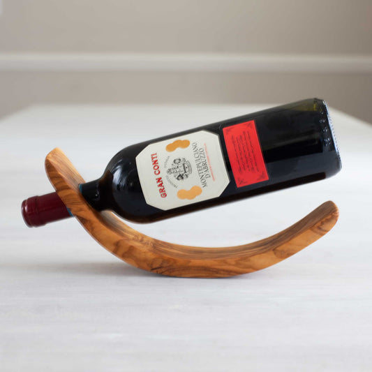 Wine bottle holder for one bottle made from olive wood