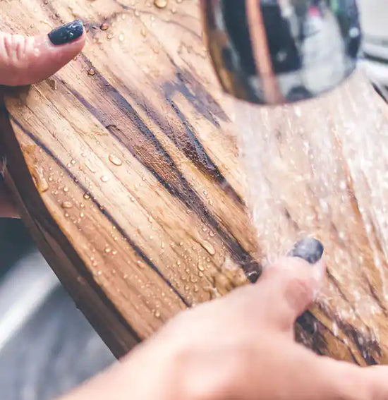 Rinse olive wood kitchen utensils
